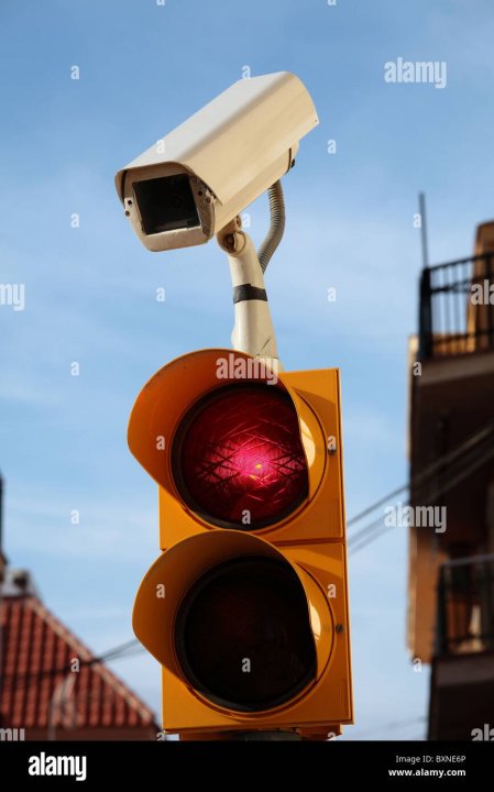cctv-camera-on-top-of-a-set-of-traffic-lights-BXNE6P.jpg
